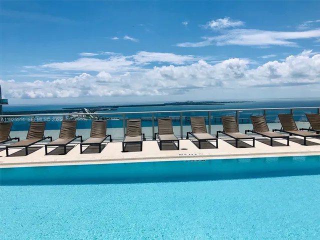 a view of a patio with couches table and chairs and potted plants