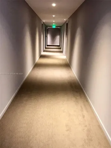 a view of swimming pool with outdoor seating and plants