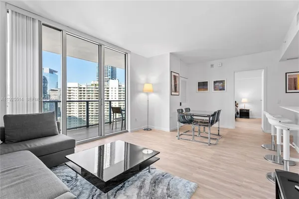 a living room with furniture and a window