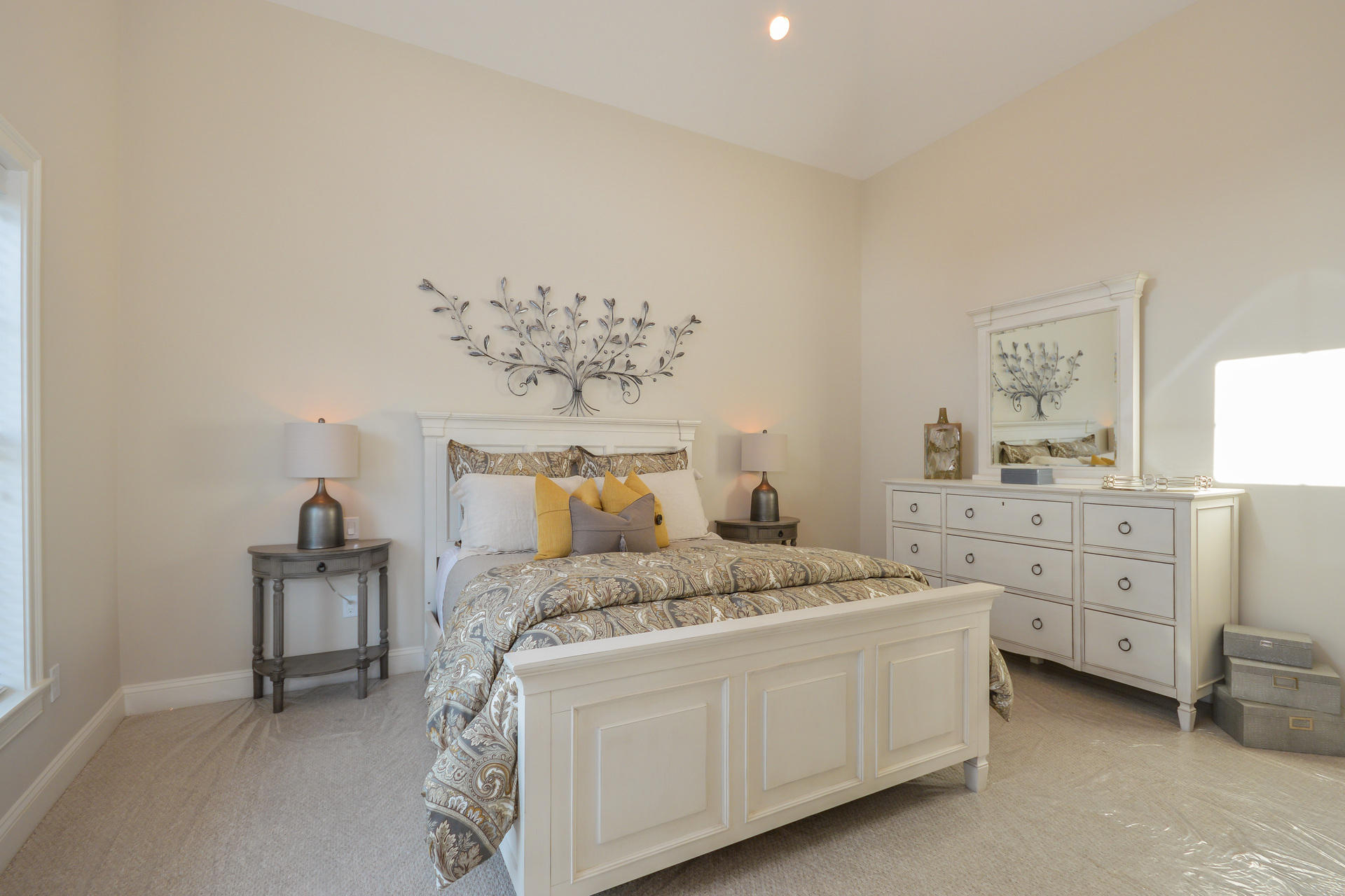8 Azalea Lane Mashpee, MA 02649 - Photo 11 of 30 a bedroom with a bed and a chandelier