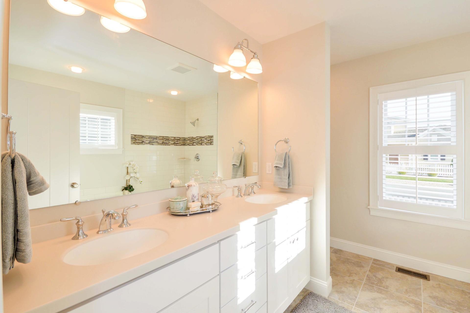 8 Azalea Lane Mashpee, MA 02649 - Photo 14 of 30 a bathroom with a double vanity sink and a mirror
