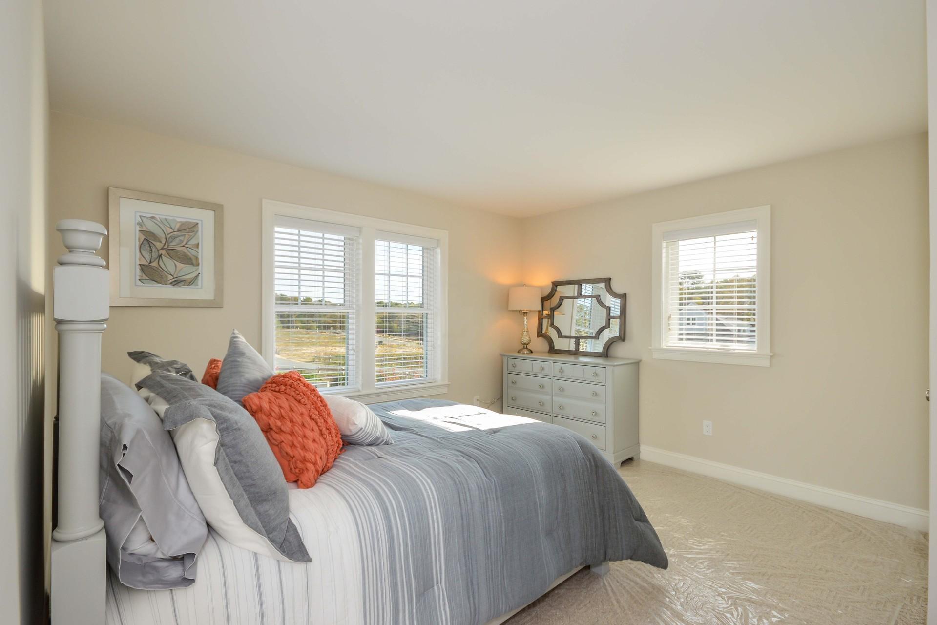 8 Azalea Lane Mashpee, MA 02649 - Photo 15 of 30 a bedroom with a large bed and a window