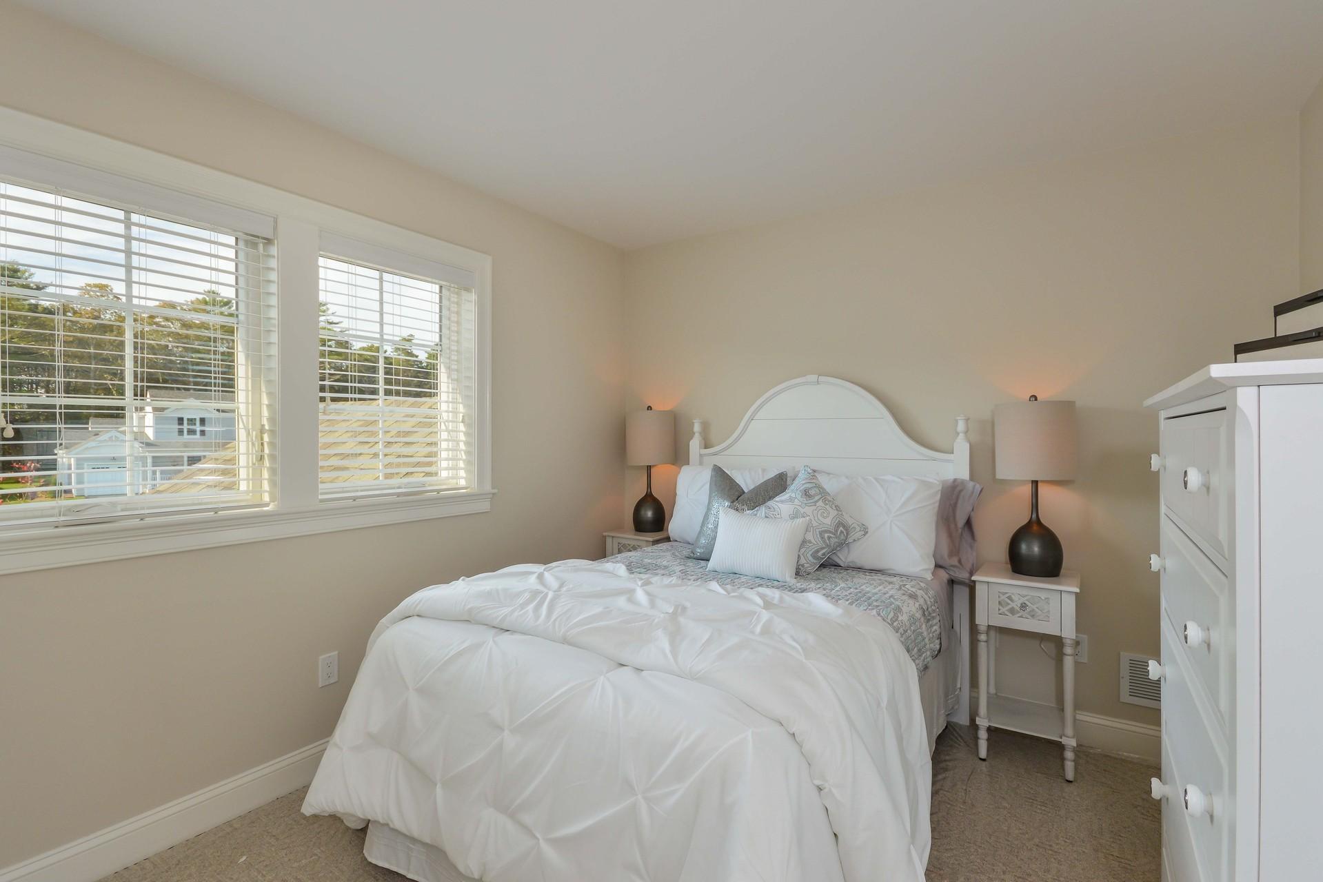 8 Azalea Lane Mashpee, MA 02649 - Photo 16 of 30 a large bed sitting in a bedroom next to a window