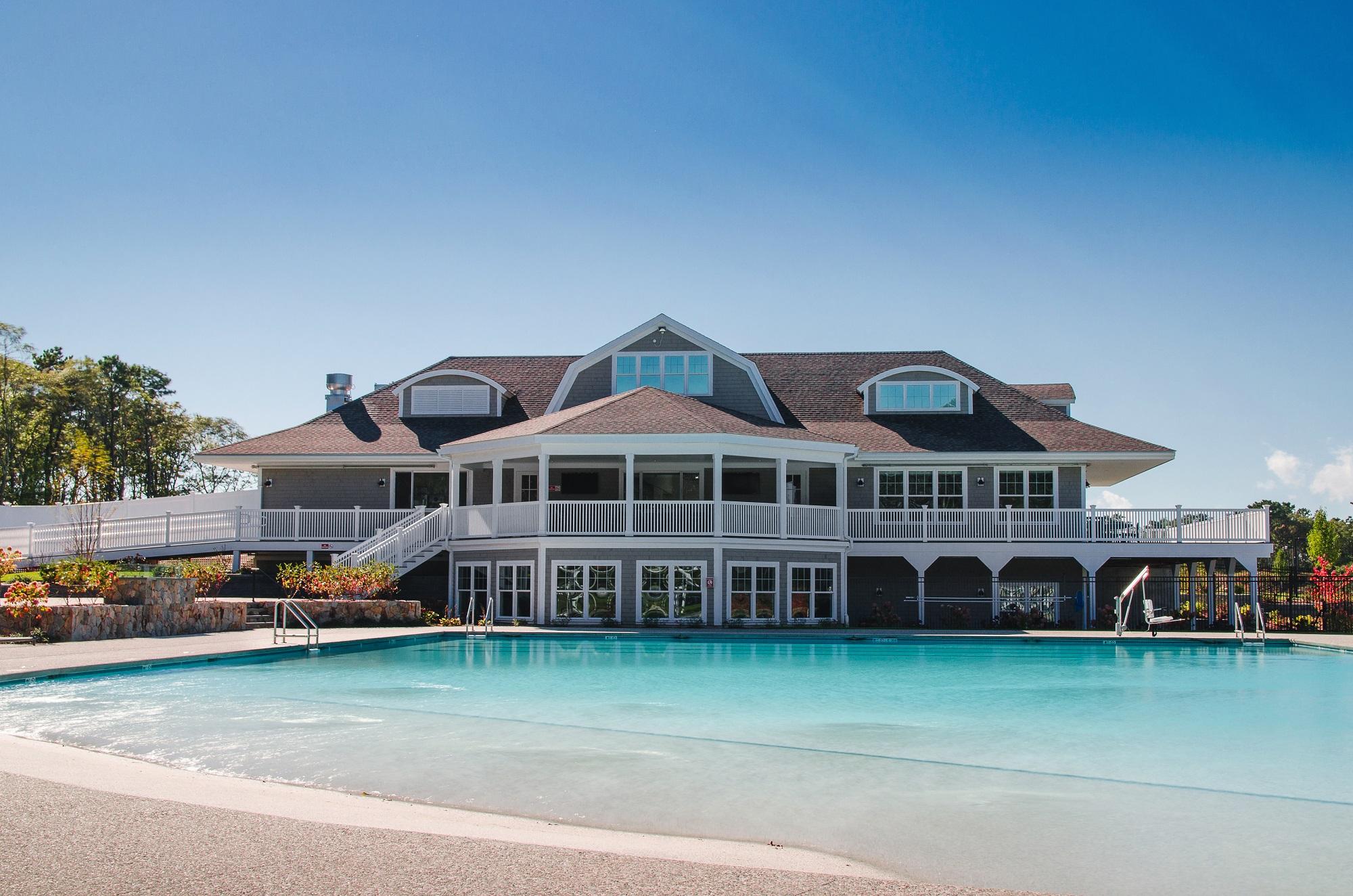 8 Azalea Lane Mashpee, MA 02649 - Photo 25 of 30 a front view of a house with a garden and lake view