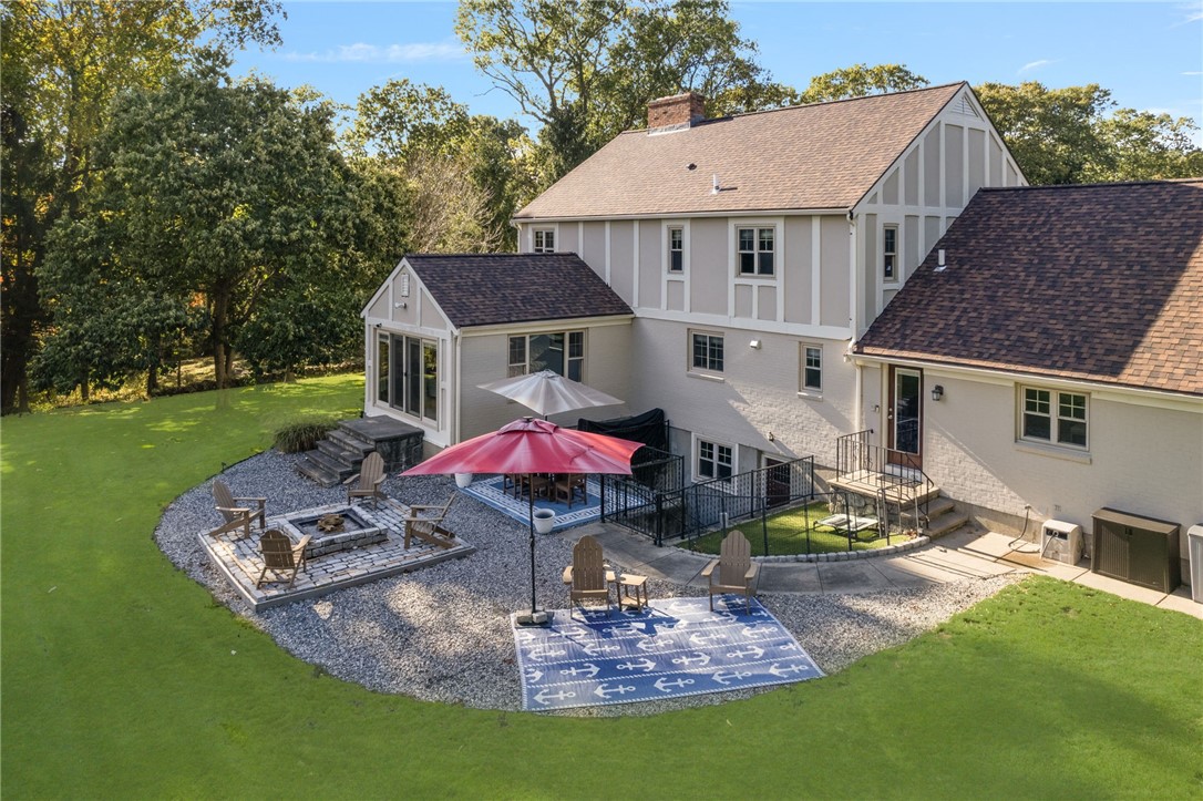 365 West Wrentham Road Cumberland, RI 02864 - Photo 4 of 50 Beautifully manicured lawn and patio/fire pit area
