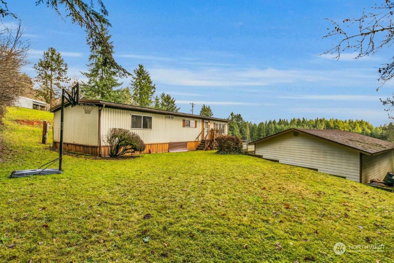 487 Tennessee Road Winlock, WA 98596 - Photo 29 of 33 a view of a house with a yard