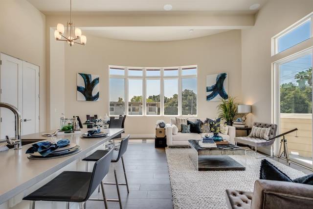 889 North San Antonio Road, Unit 2000 Los Altos, CA 94022 - Photo 7 of 14 a living room with furniture floor to ceiling window and a table