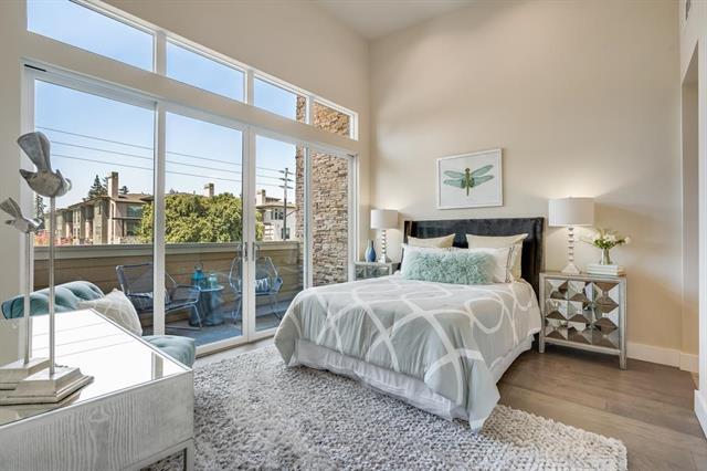 889 North San Antonio Road, Unit 2000 Los Altos, CA 94022 - Photo 9 of 14 a bedroom with a bed and a large window
