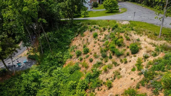 a aerial view of a house with a yard