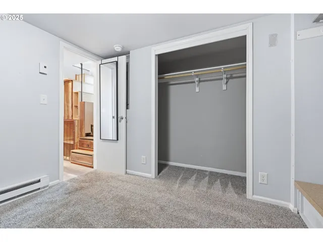 a view of a house with wooden fence