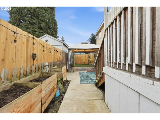 a view of a balcony with wooden fence