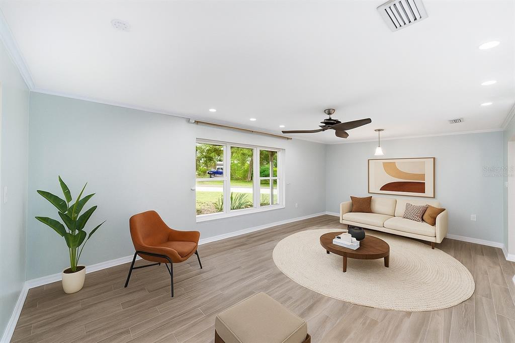4805 Southwest 19th Street Gainesville, FL 32608 - Photo 12 of 43 a living room with furniture and a potted plant