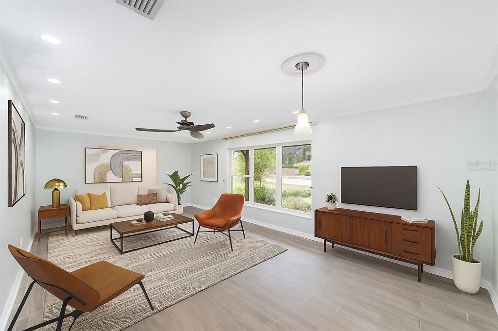 4805 Southwest 19th Street Gainesville, FL 32608 - Photo 13 of 43 a living room with furniture and a flat screen tv