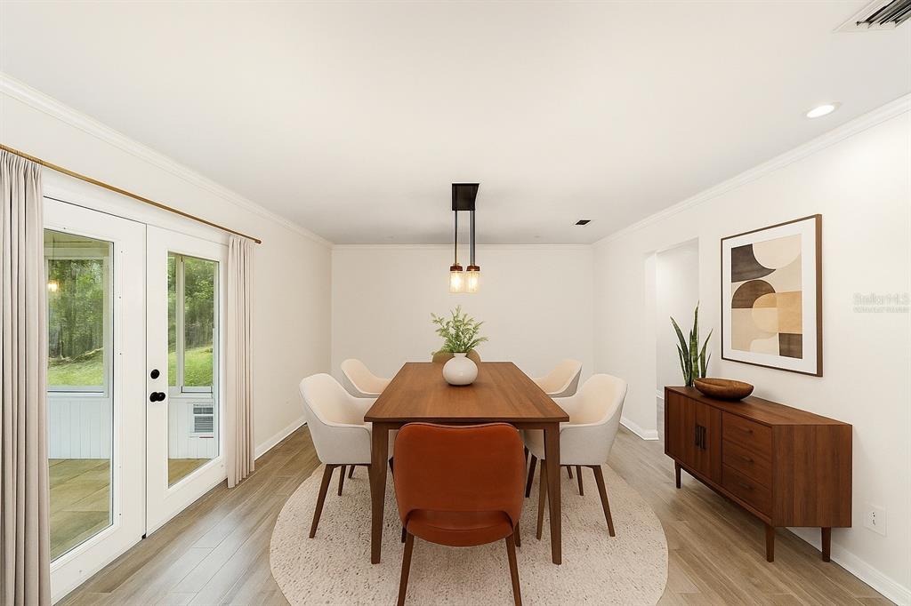 4805 Southwest 19th Street Gainesville, FL 32608 - Photo 15 of 43 a dining room with furniture and window
