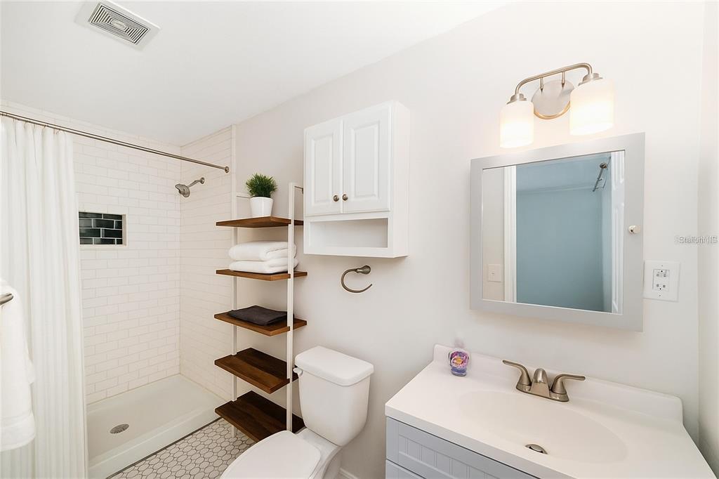 4805 Southwest 19th Street Gainesville, FL 32608 - Photo 25 of 43 a bathroom with a sink a toilet and shower