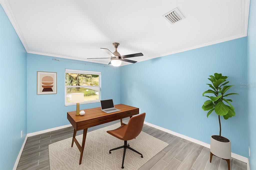 4805 Southwest 19th Street Gainesville, FL 32608 - Photo 29 of 43 a living room with furniture and a potted plant