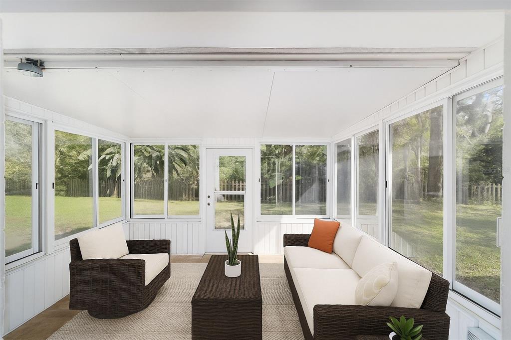 4805 Southwest 19th Street Gainesville, FL 32608 - Photo 32 of 43 a living room with furniture and a large window