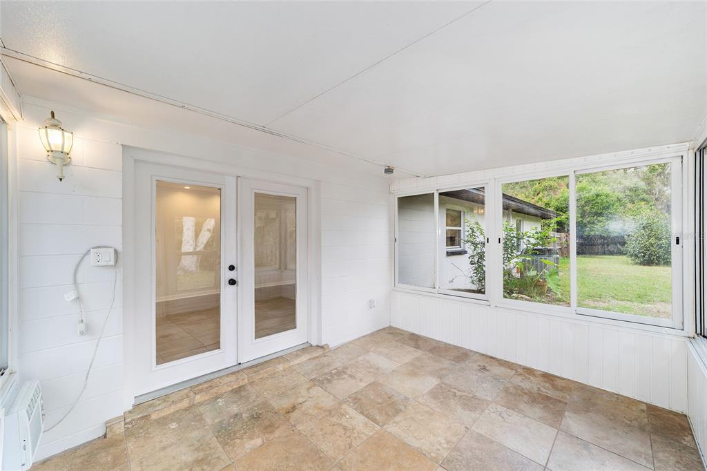 4805 Southwest 19th Street Gainesville, FL 32608 - Photo 33 of 43 a view of an empty room with glass door and balcony
