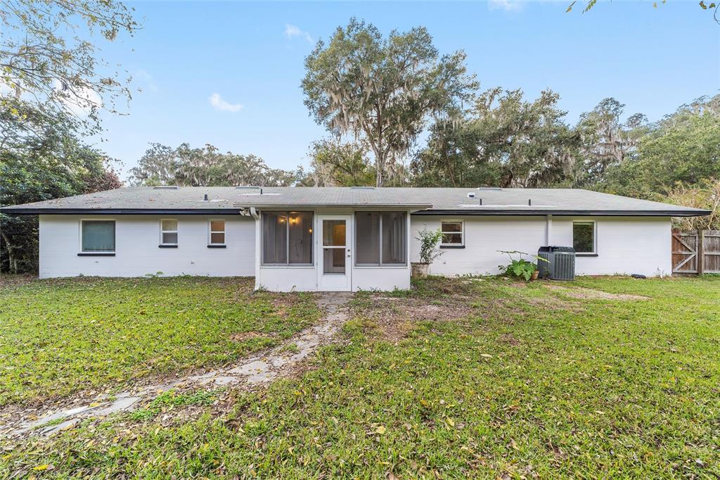 4805 Southwest 19th Street Gainesville, FL 32608 - Photo 35 of 43 a view of a house with a yard