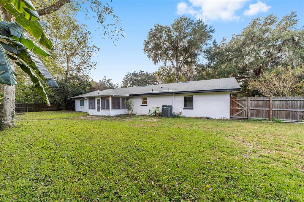 4805 Southwest 19th Street Gainesville, FL 32608 - Photo 36 of 43 a front view of a house with garden