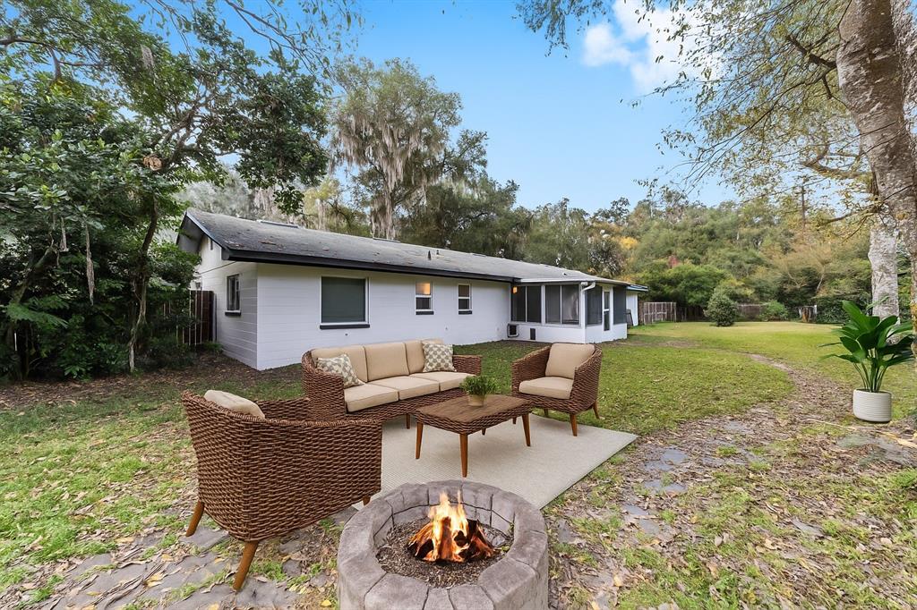 4805 Southwest 19th Street Gainesville, FL 32608 - Photo 37 of 43 a view of a house with backyard and sitting area