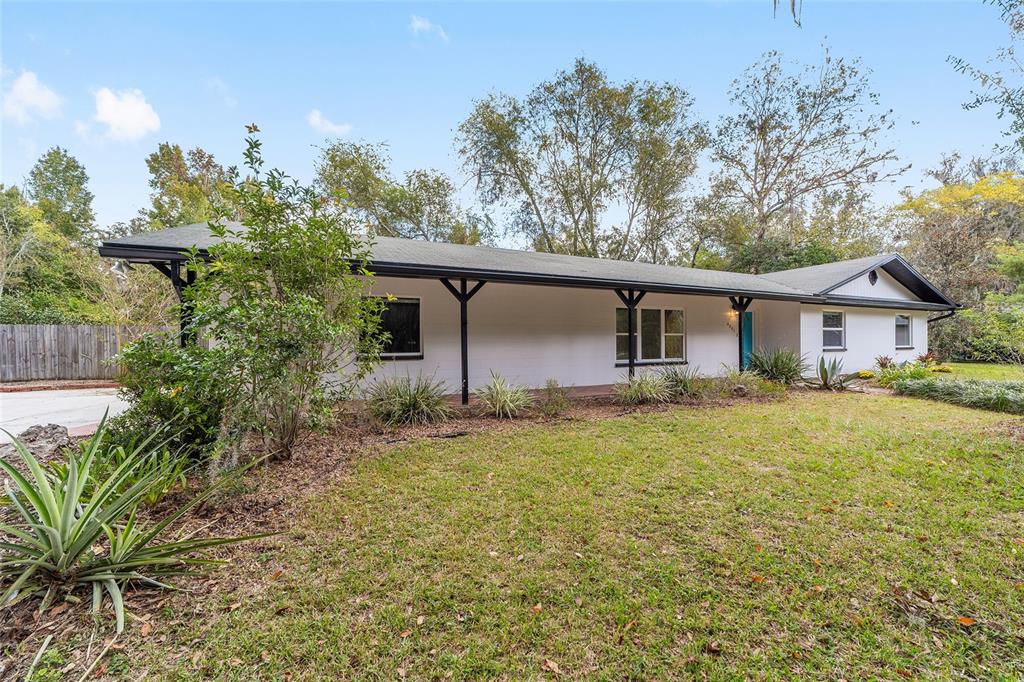 4805 Southwest 19th Street Gainesville, FL 32608 - Photo 5 of 43 a front view of house with yard and trees around