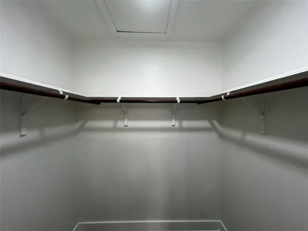 a view of a room with racks on the wall