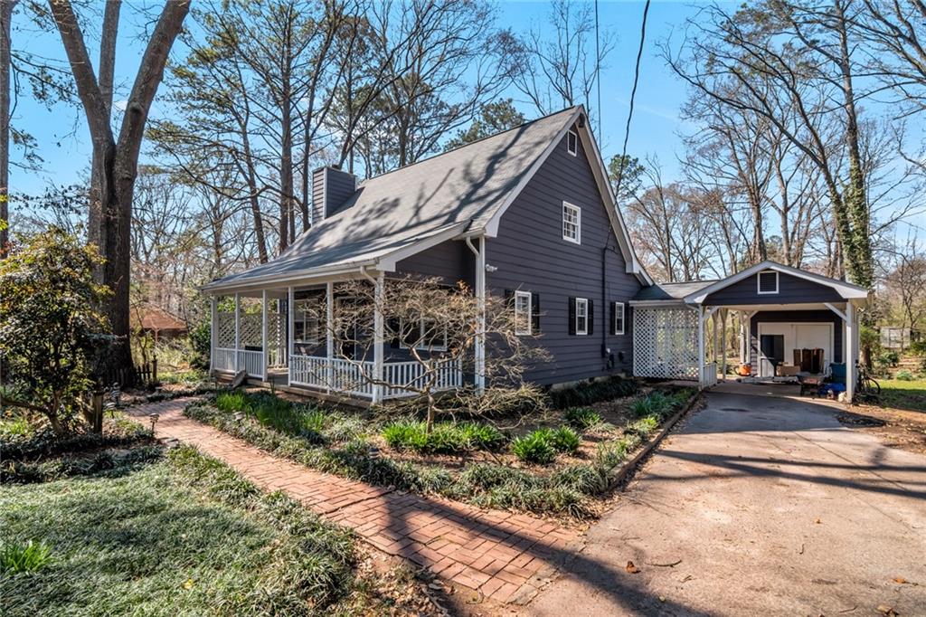 1198 Dixie Road Covington, GA 30014 - Photo 1 of 1 a front view of a house with garden
