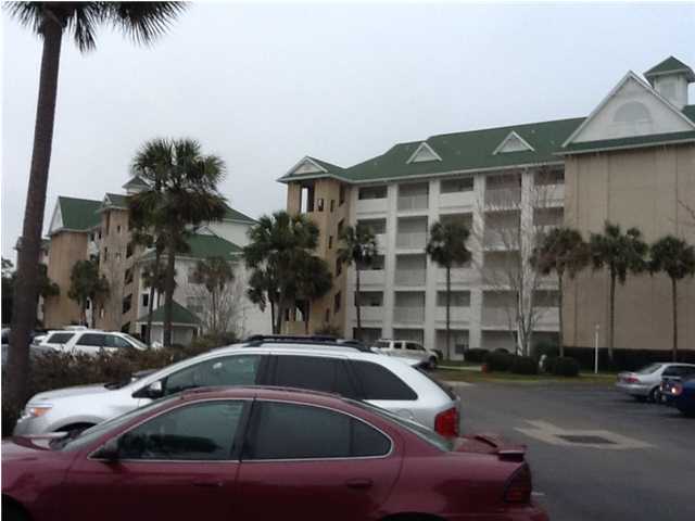 4270 Calinda Lane, Unit 357 Niceville, FL 32578 - Photo 1 of 17 a view of a street that has couple of cars parked in front of it
