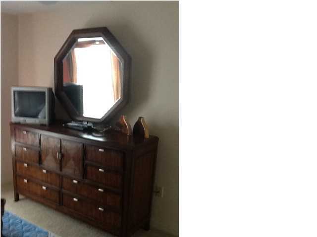 4270 Calinda Lane, Unit 357 Niceville, FL 32578 - Photo 13 of 17 a bathroom with a sink vanity and mirror
