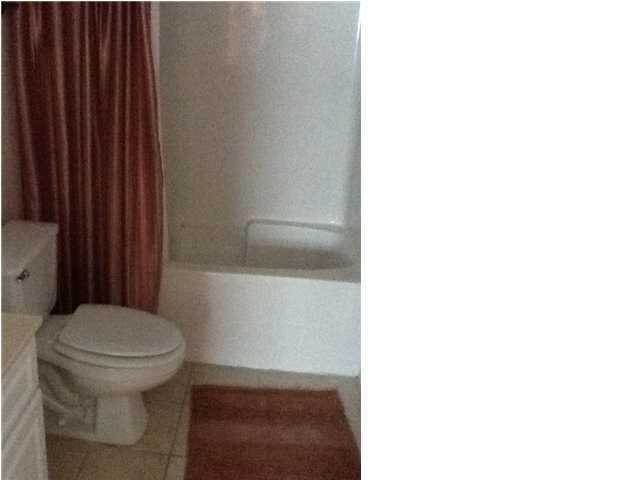 4270 Calinda Lane, Unit 357 Niceville, FL 32578 - Photo 14 of 17 a white toilet sitting next to a shower