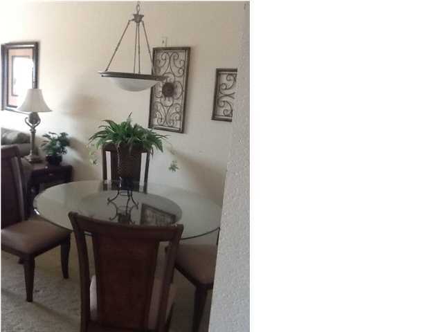 4270 Calinda Lane, Unit 357 Niceville, FL 32578 - Photo 5 of 17 a table and chairs in a room