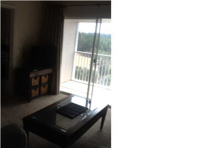 4270 Calinda Lane, Unit 357 Niceville, FL 32578 - Photo 7 of 17 a living room with furniture and a window