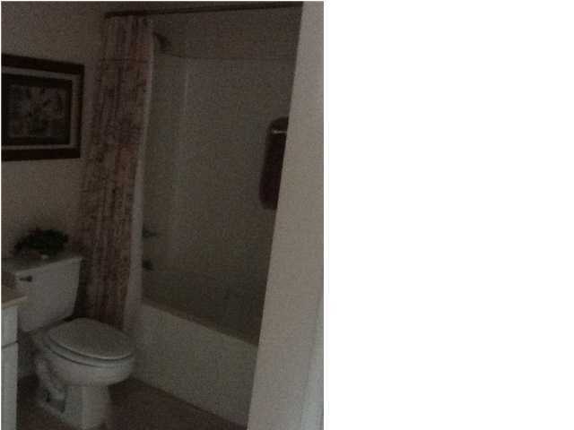 4270 Calinda Lane, Unit 357 Niceville, FL 32578 - Photo 9 of 17 a bathroom with a toilet and a shower