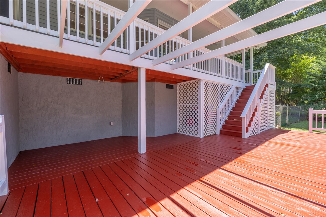 429 Burns Mill Road West Union, SC 29696 - Photo 35 of 49 A spacious red deck with an overhead pergola offers abundant outdoor living space.