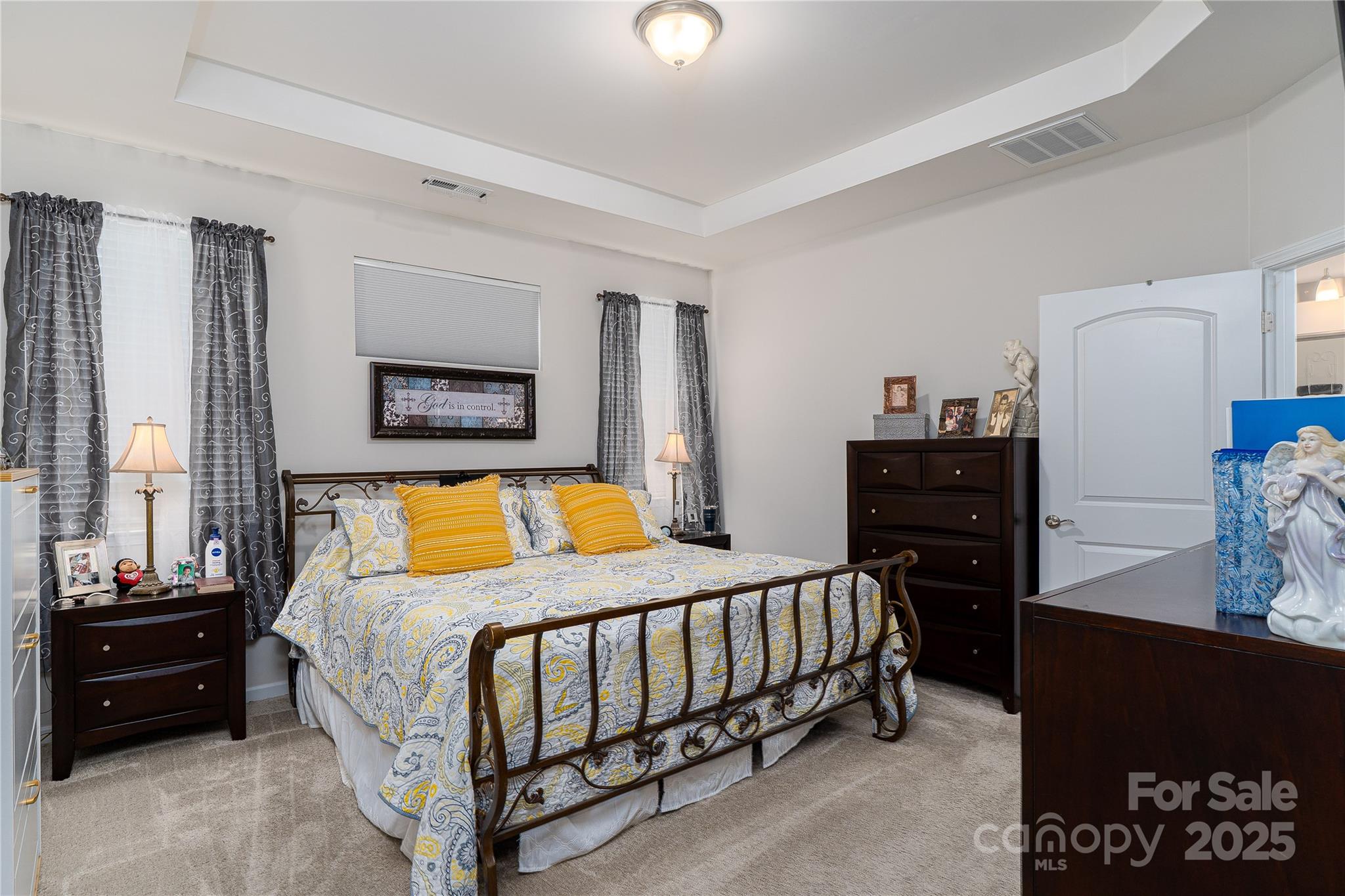 550 Rustlewood Way Rock Hill, SC 29732 - Photo 13 of 33 a bedroom with a bed and dresser with mirror