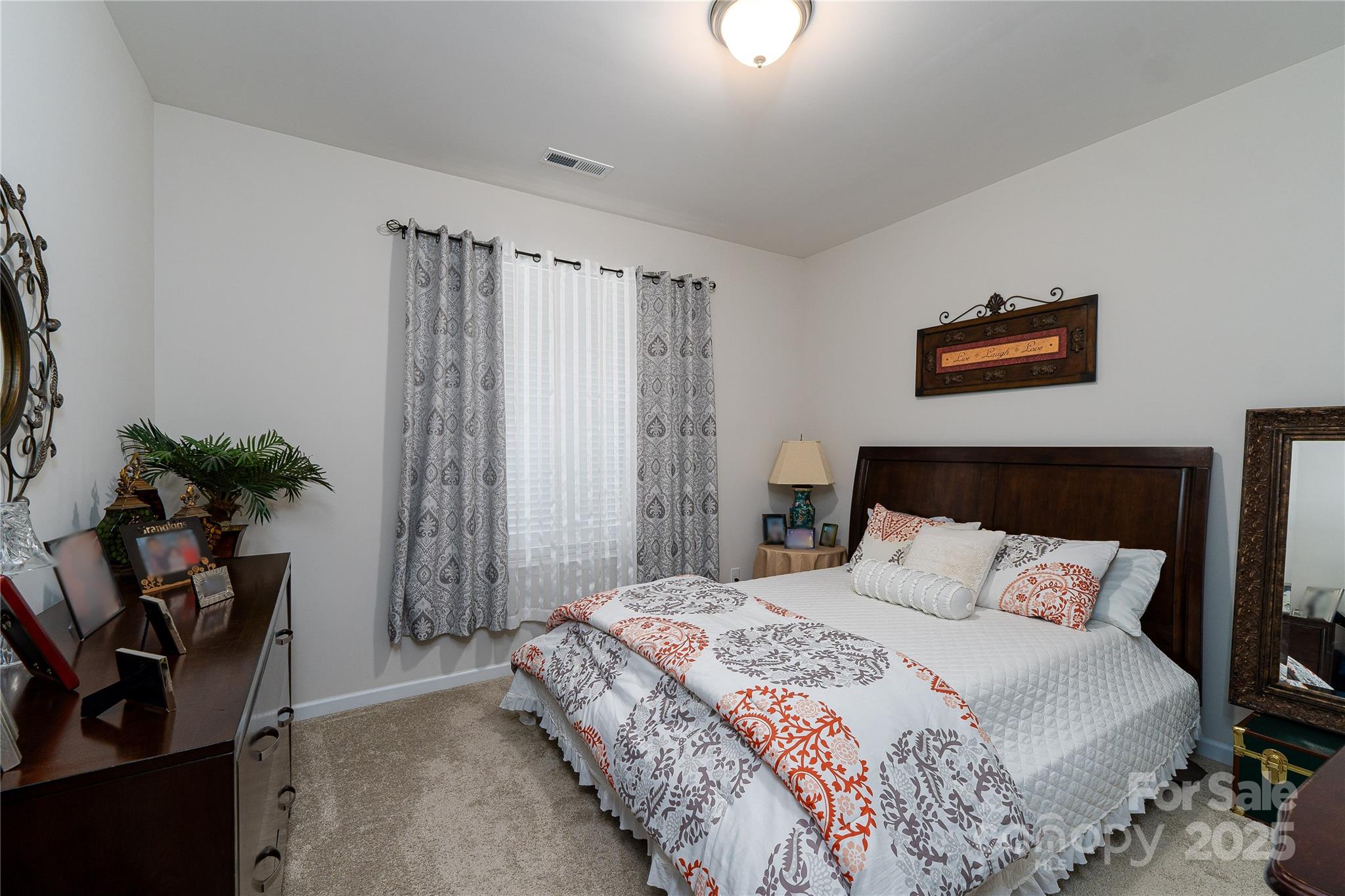 550 Rustlewood Way Rock Hill, SC 29732 - Photo 15 of 33 a bedroom with a bed and a potted plant