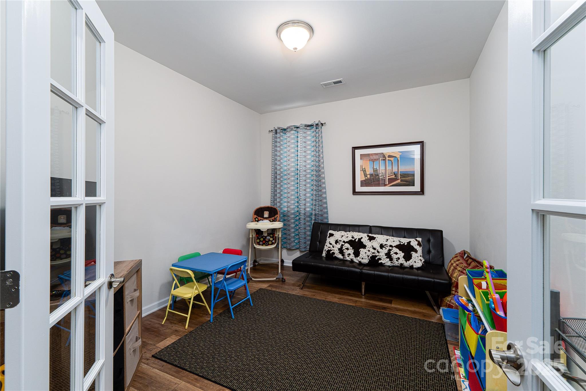 550 Rustlewood Way Rock Hill, SC 29732 - Photo 18 of 33 a living room with furniture a baby crib and a wooden floor
