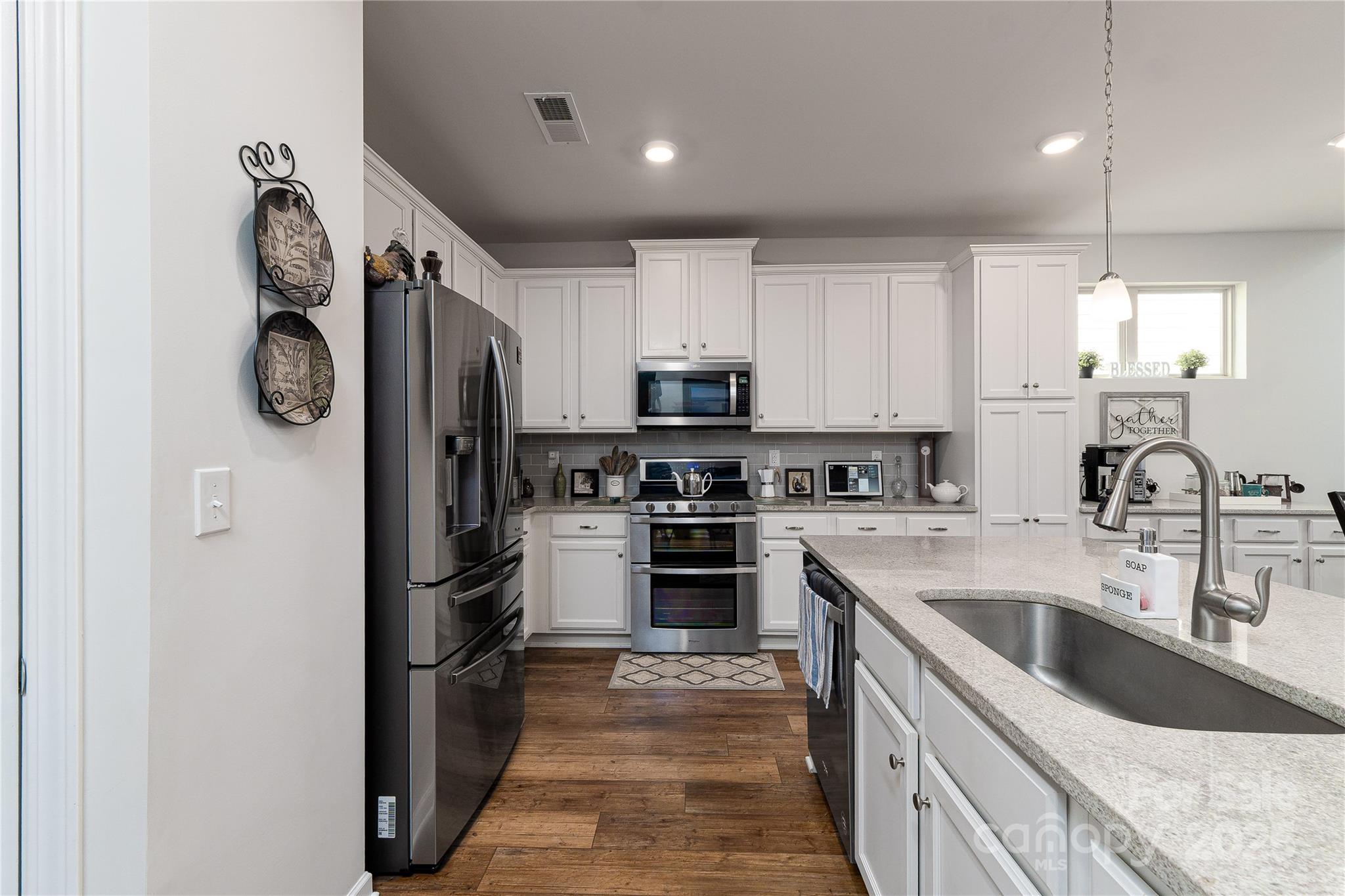 550 Rustlewood Way Rock Hill, SC 29732 - Photo 20 of 33 a kitchen with stainless steel appliances granite countertop a refrigerator and a sink