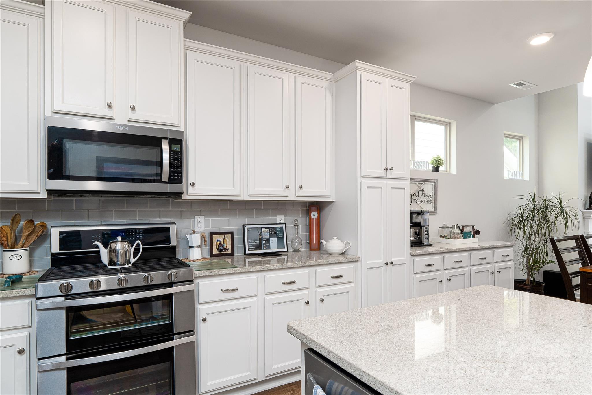 550 Rustlewood Way Rock Hill, SC 29732 - Photo 23 of 33 a kitchen with stainless steel appliances white cabinets and a stove a oven