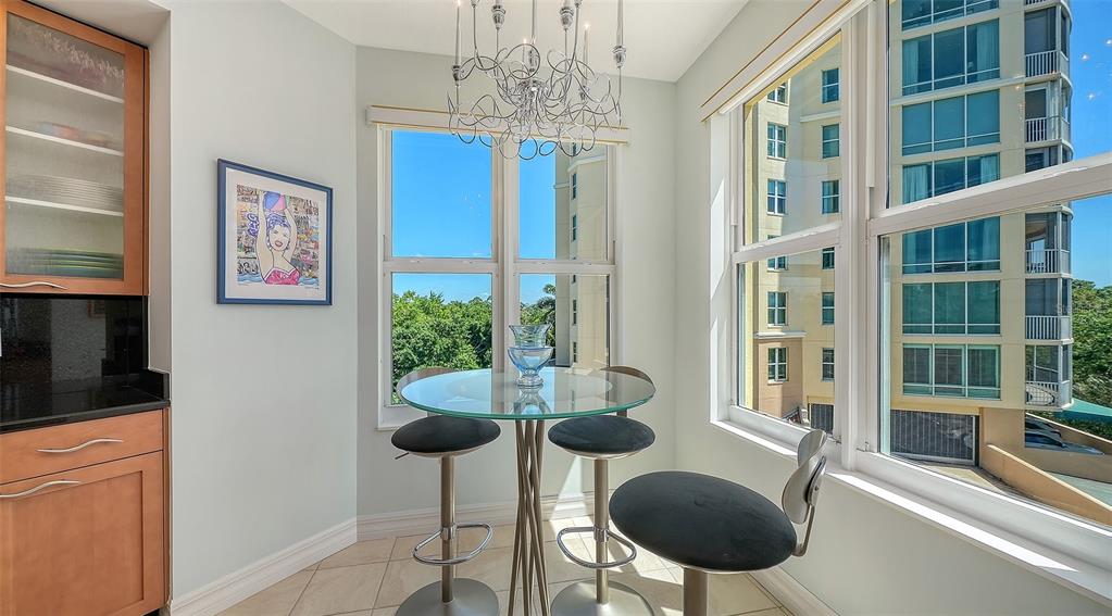 409 North Point Road, Unit 401 Osprey, FL 34229 - Photo 22 of 90 a view of a livingroom with furniture and a floor to ceiling window