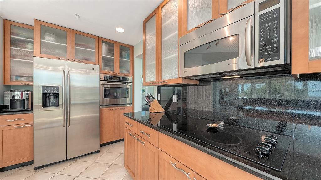 409 North Point Road, Unit 401 Osprey, FL 34229 - Photo 23 of 90 a kitchen with a sink and stainless steel appliances