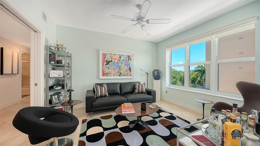 409 North Point Road, Unit 401 Osprey, FL 34229 - Photo 27 of 90 a living room with furniture and a rug