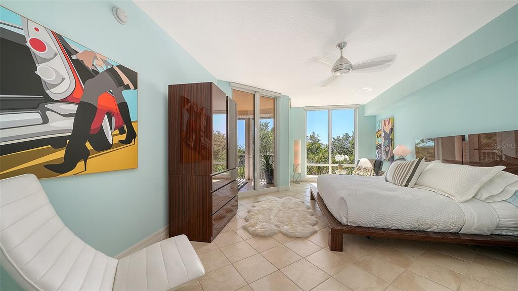 409 North Point Road, Unit 401 Osprey, FL 34229 - Photo 28 of 90 a bedroom with a bed and a window
