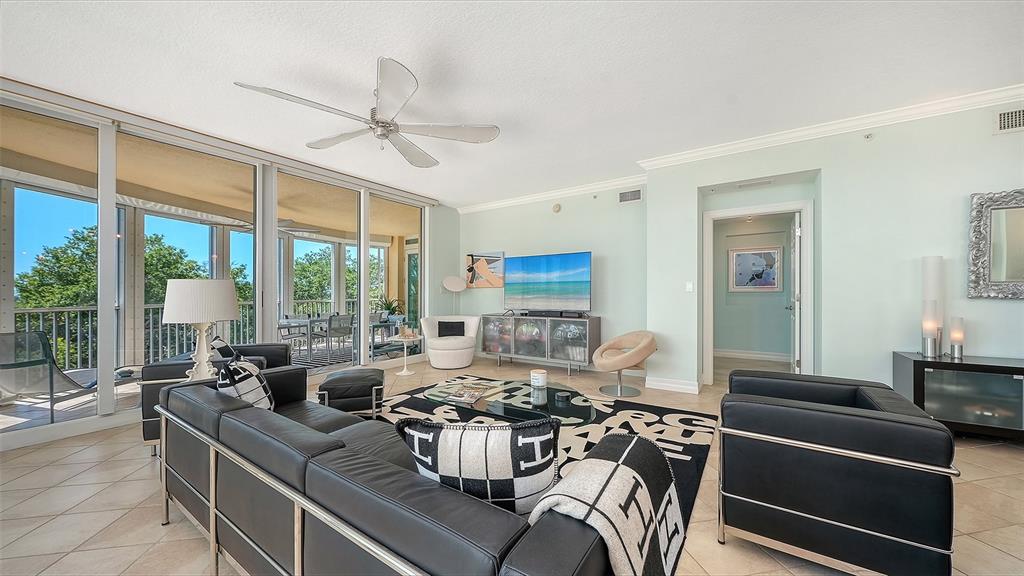 409 North Point Road, Unit 401 Osprey, FL 34229 - Photo 8 of 90 a living room with furniture and a large window