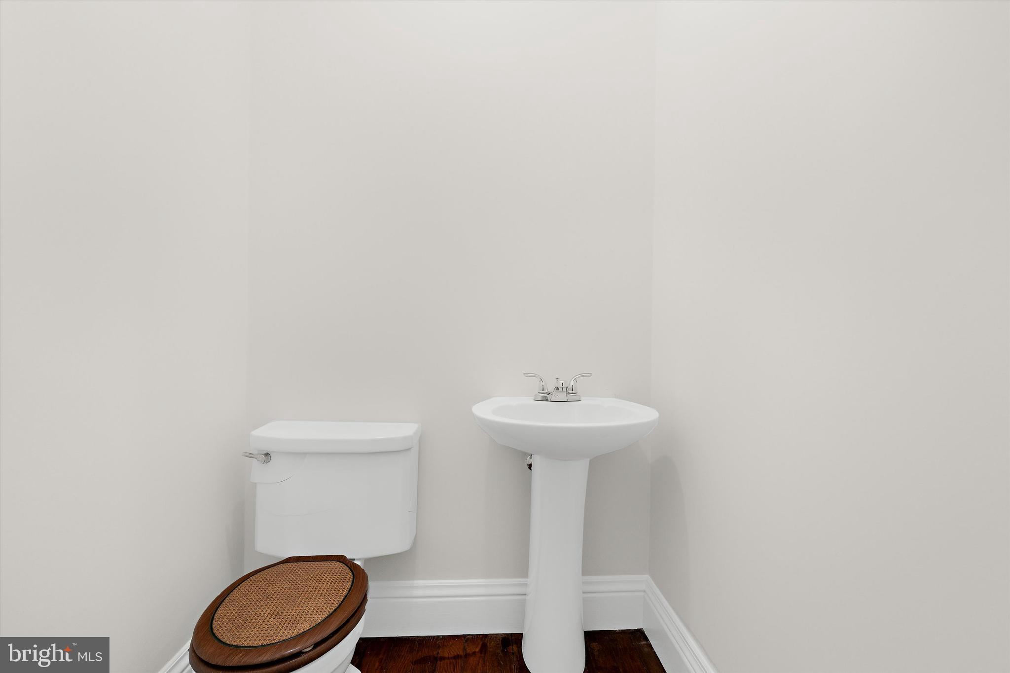 500 Nesbit Road Queenstown, MD 21658 - Photo 14 of 53 a bathroom with a sink a toilet and a mirror