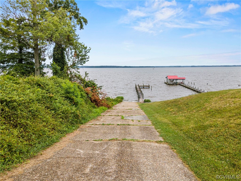 10141 Sycamore Landing Road Williamsburg, VA 23188 - Photo 12 of 15 a view of a lake with a big yard