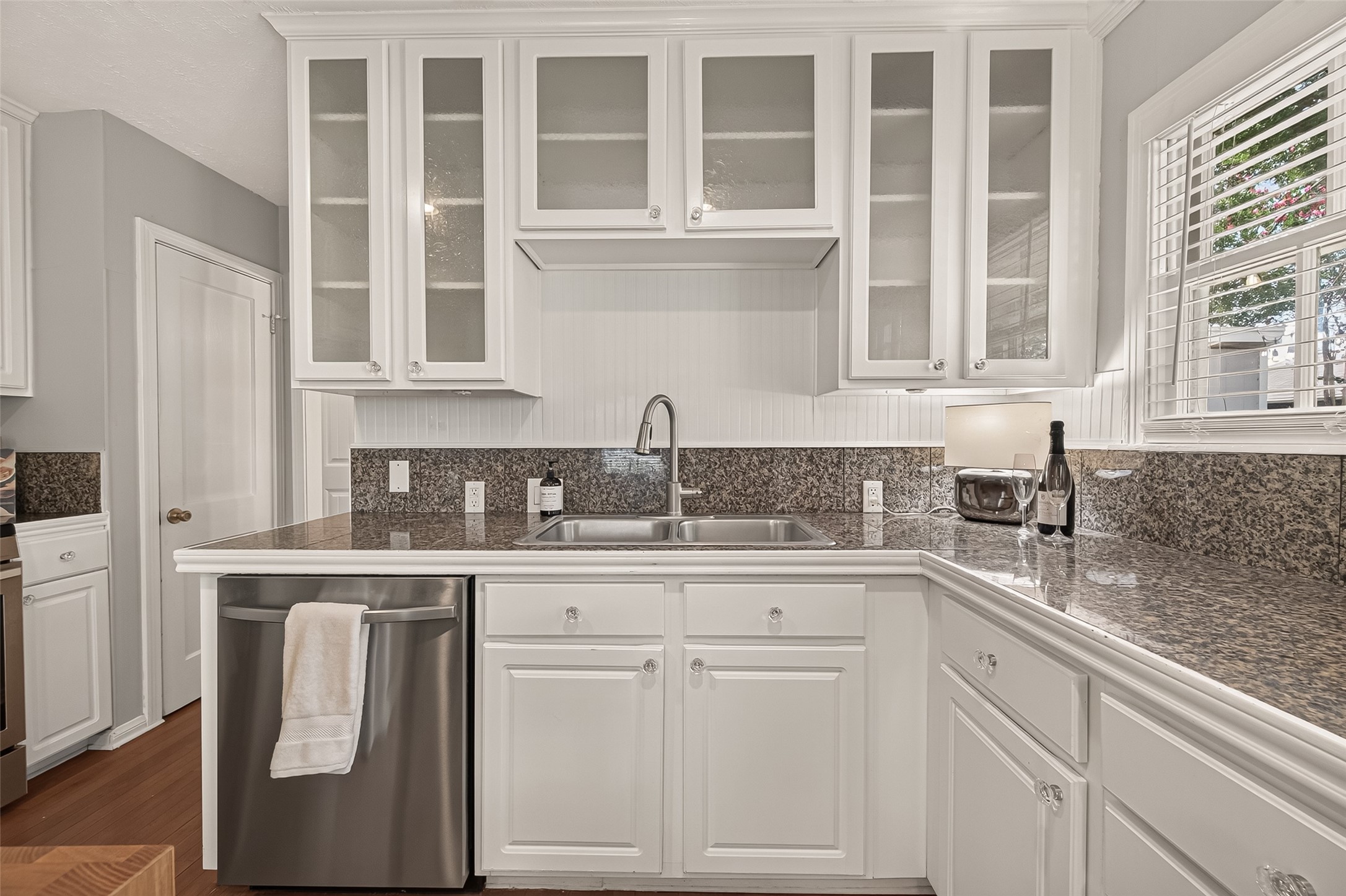 2019 Gostick Street Houston, TX 77008 - Photo 21 of 36 a kitchen with white cabinets and a sink