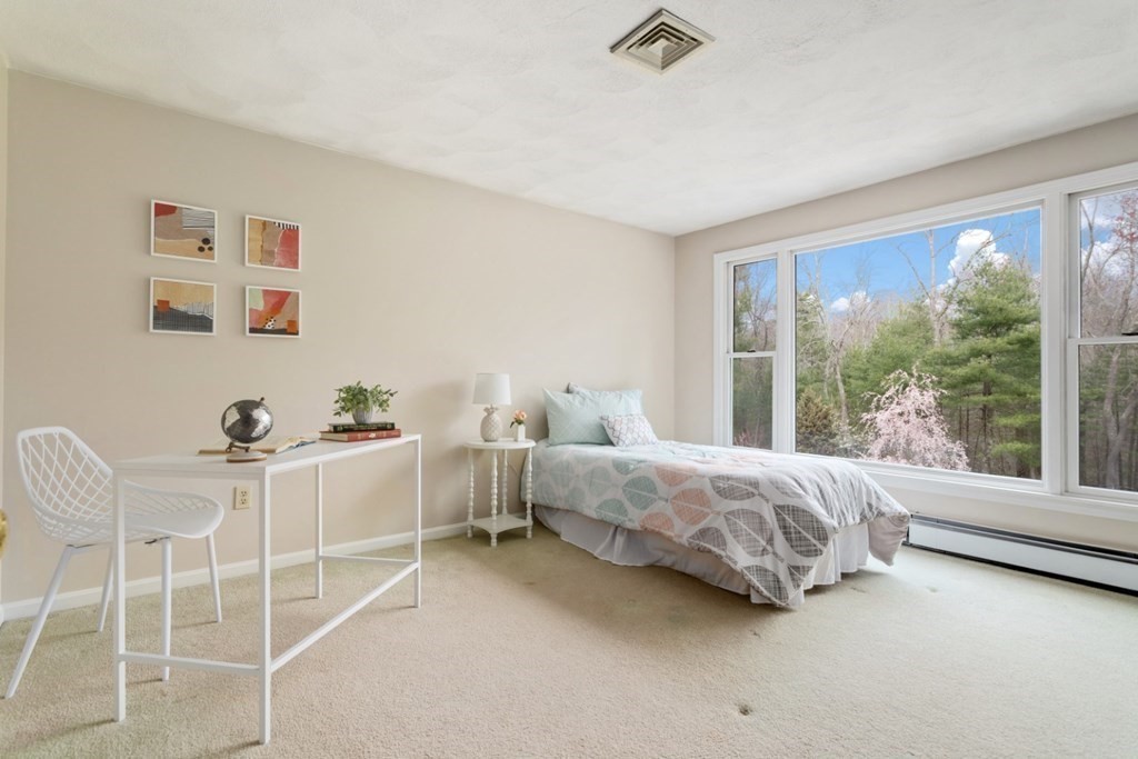 4 Darrell Drive North Reading, MA 01864 - Photo 20 of 41 a room with a bed and a view of living room