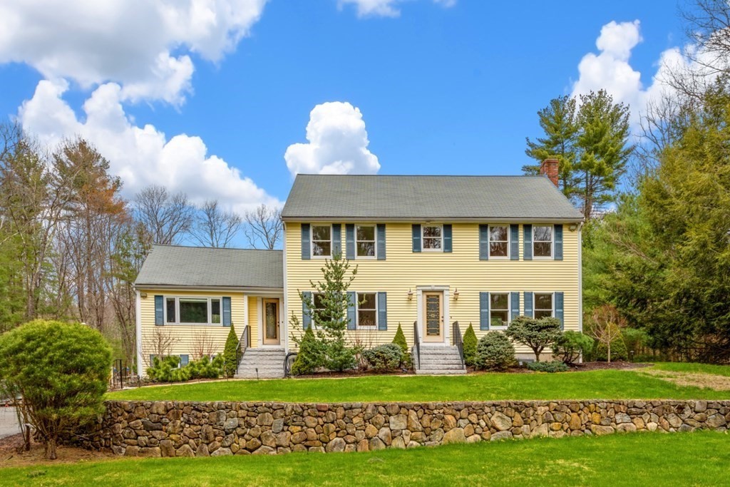 4 Darrell Drive North Reading, MA 01864 - Photo 2 of 41 a view of a white house with a yard and potted plants